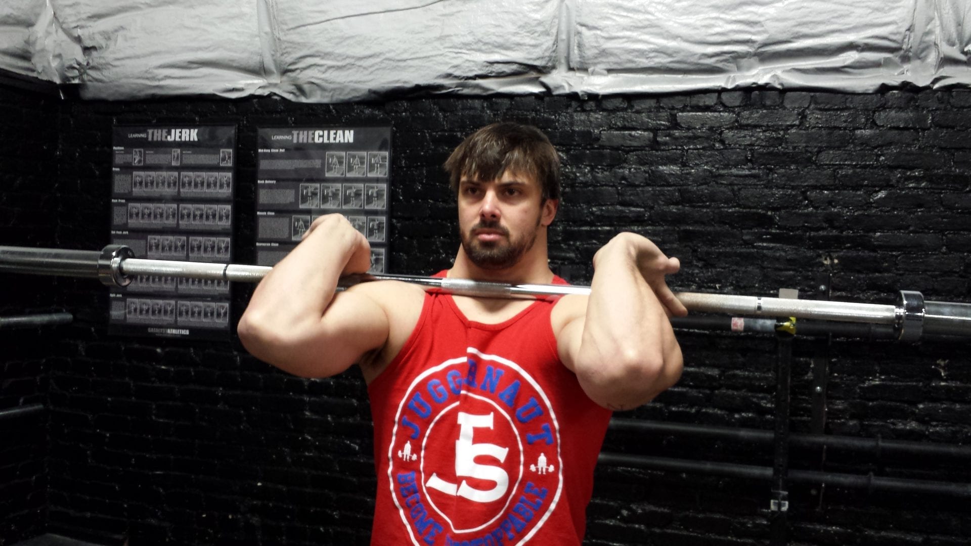 Improper front rack, front view | Juggernaut Training Systems